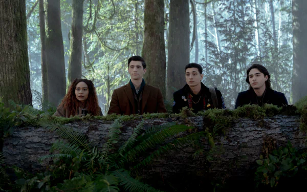HD desktop wallpaper of 'Dead Boy Detectives' TV show featuring four young characters peering over a log in a foggy forest.