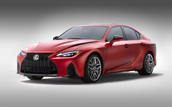 HD desktop wallpaper of a red Lexus IS 500 F Sport Performance, showcasing its sleek design and dynamic aesthetics against a gradient background.