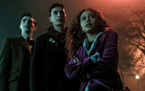 HD wallpaper featuring characters from the TV show Dead Boy Detectives standing together at night, looking upwards with serious expressions.