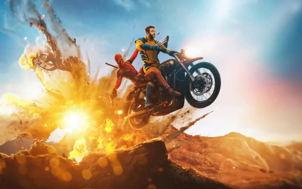 HD desktop wallpaper of Deadpool and Wolverine riding a motorcycle amidst a dramatic explosion in a rugged landscape.