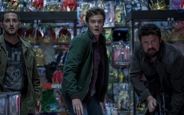 HD desktop wallpaper featuring a dramatic scene from the TV Show The Boys (2019), with three characters standing in a tense moment inside a colorful store filled with various toys and costumes.