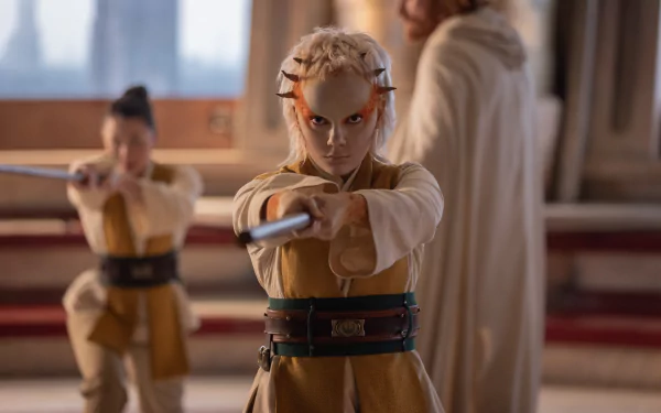 Scene from The Acolyte (2024) TV show featuring characters in warrior attire, focused and holding swords, set against a dramatic, well-lit backdrop. HD desktop wallpaper and background.