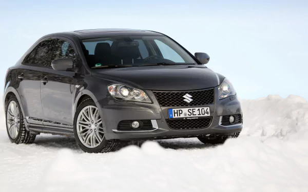 HD desktop wallpaper of a Suzuki Kizashi Sport, featuring a sleek black car positioned against a snowy background.
