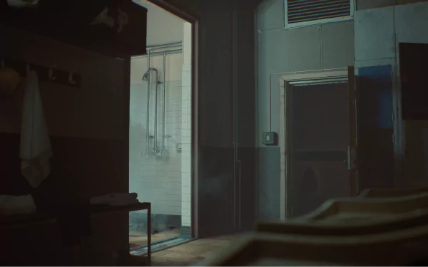 HD wallpaper of the video game 'Still Wakes the Deep,' featuring a dimly lit, eerie room with open doors leading to a shower area.