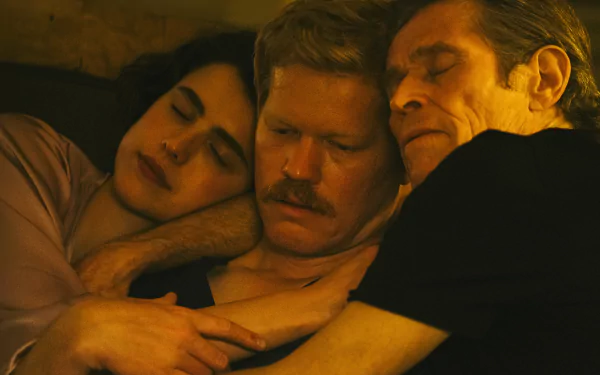 A warm and intimate scene from the movie Kinds of Kindness, featuring three characters in a close embrace, showcasing their connection and affection in this HD desktop wallpaper.