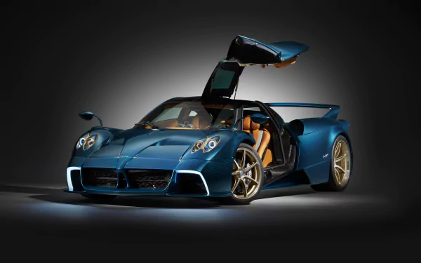 HD desktop wallpaper featuring a Pagani Huayra Epitome. The car is showcased against a dark background with its gullwing doors open, highlighting its sleek and luxurious blue design.