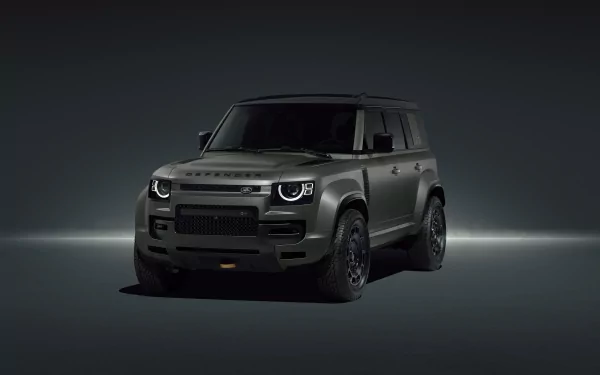 HD desktop wallpaper featuring the rugged and powerful Land Rover Defender Octa vehicle against a dark, minimalistic background.