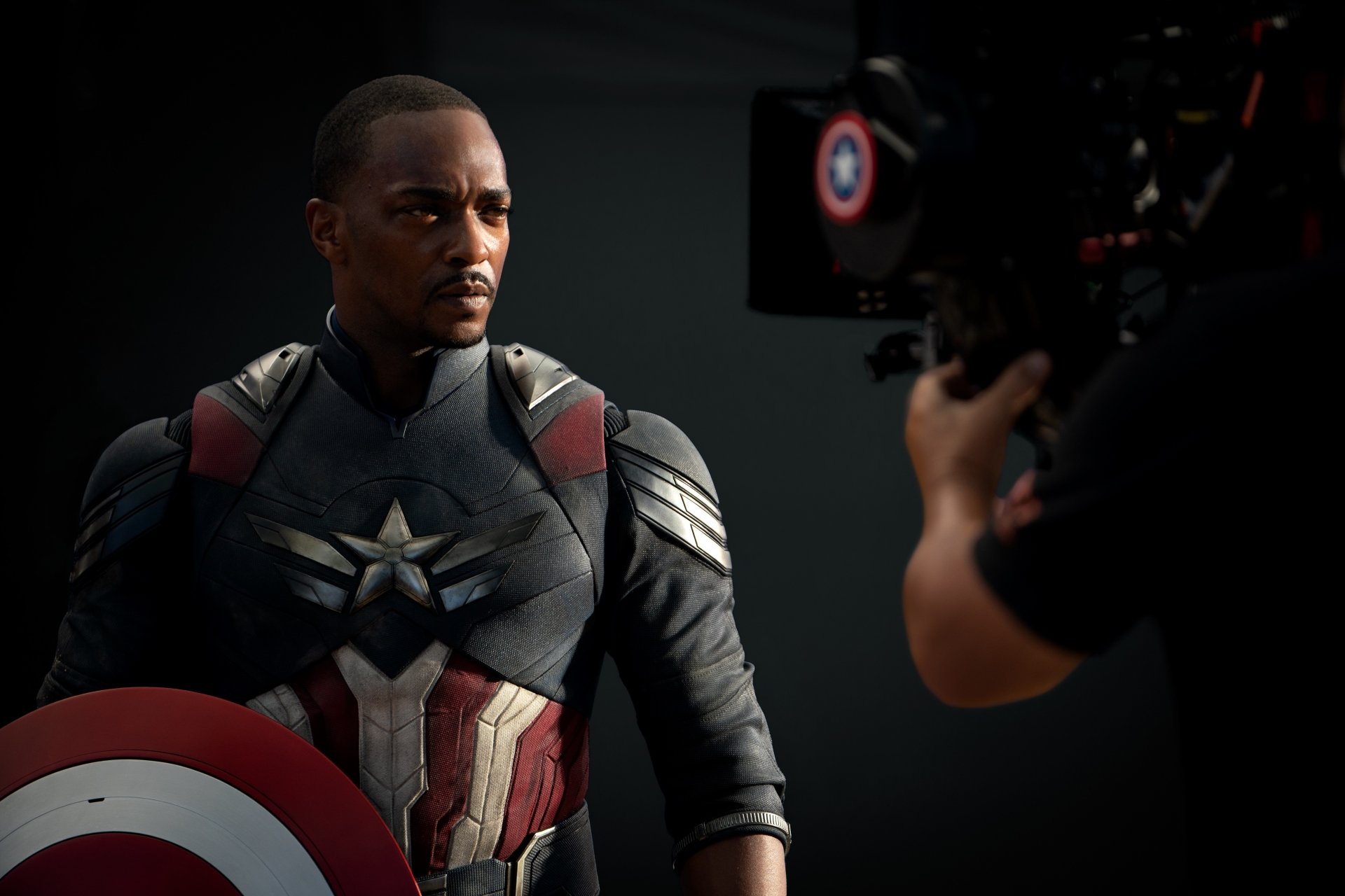 HD wallpaper featuring Anthony Mackie as the new Captain America in Captain America: Brave New World, showcasing a dynamic pose and intense expression.