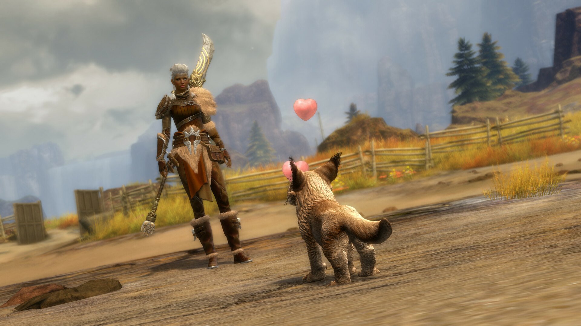 A warrior stands in the Janthir Wilds of Guild Wars 2, gazing down at a playful creature, with mountains and a heart-shaped balloon in the background, creating a vibrant HD desktop wallpaper.