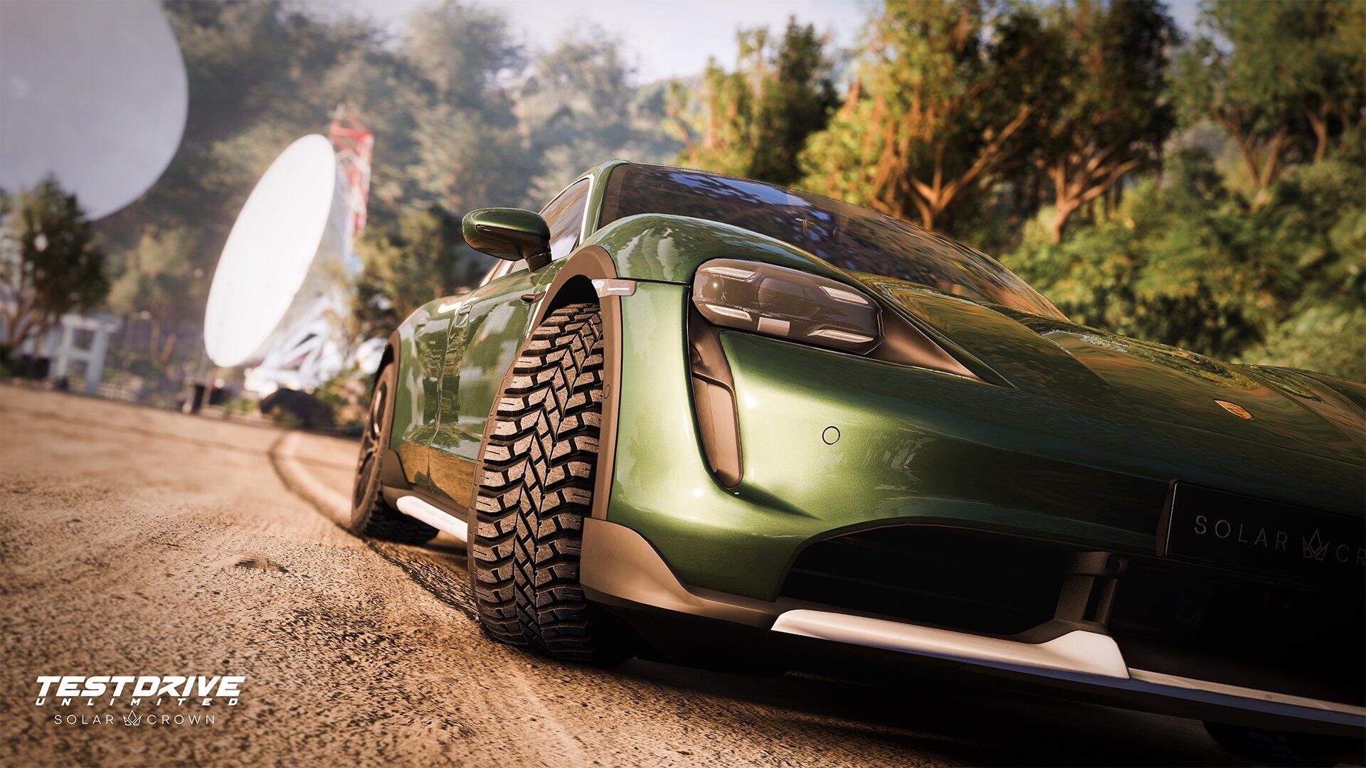 A dynamic HD wallpaper featuring a green sports car from the video game Test Drive Unlimited Solar Crown, set against a lush, natural backdrop.