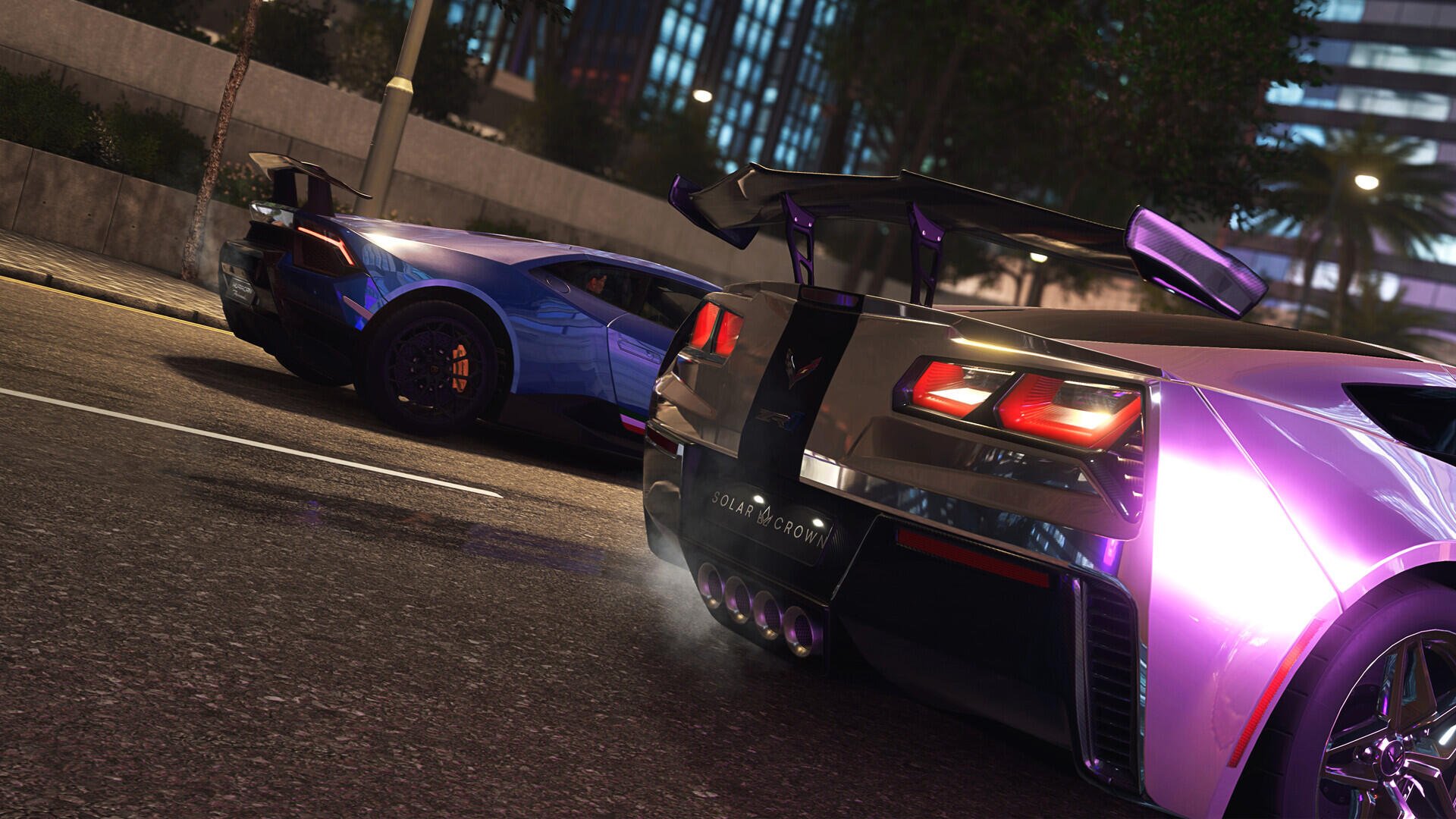 A dynamic HD wallpaper featuring two sleek cars from the game Test Drive Unlimited Solar Crown, showcasing vibrant colors and detailed design against a city backdrop.