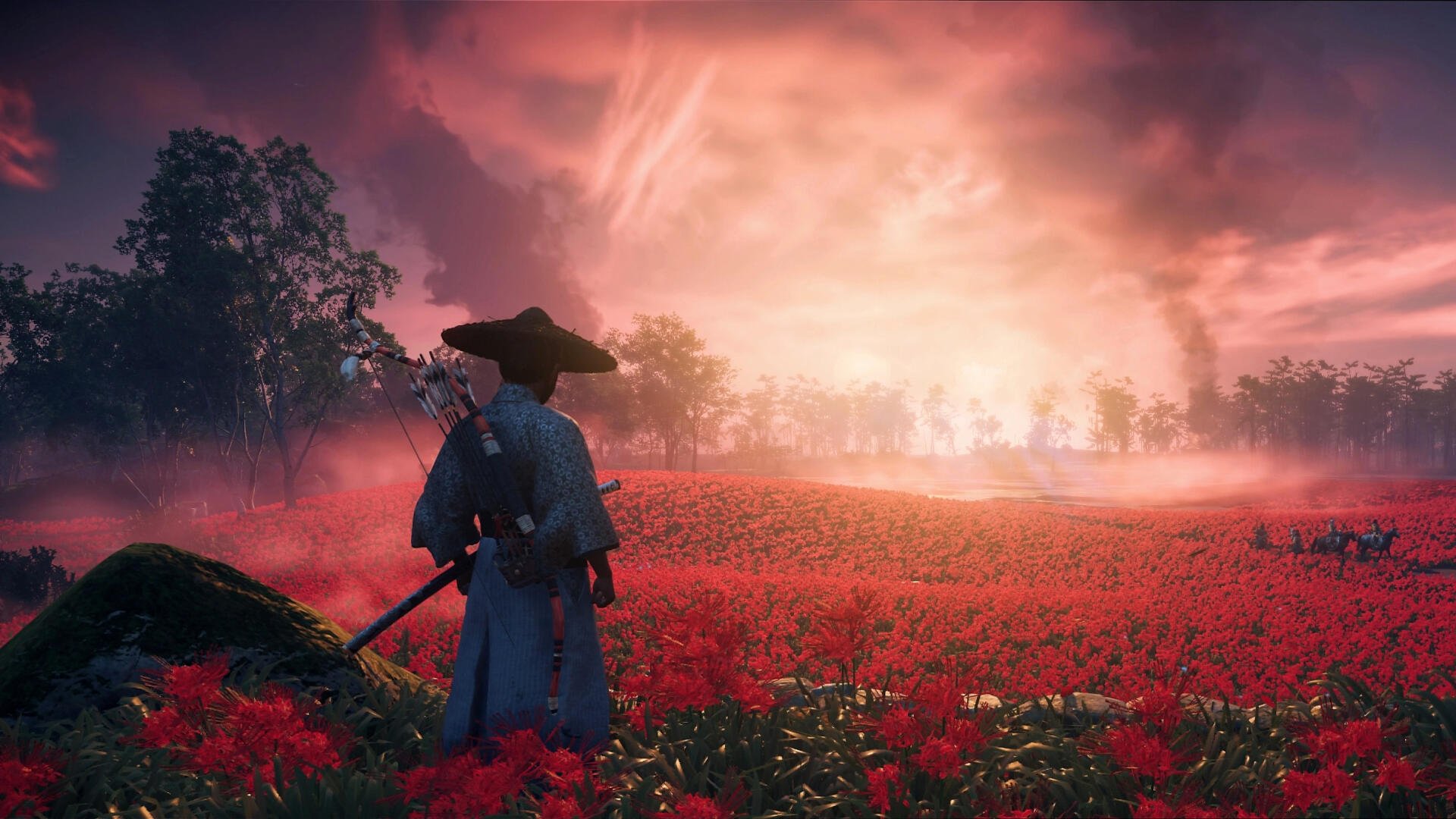 HD PC desktop wallpaper of Ghost of Tsushima featuring a warrior standing in a vast red flower field under a dramatic, glowing sky at sunset.