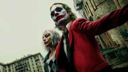 A striking 4K wallpaper featuring Joaquin Phoenix and Lady Gaga as the Joker and Harley Quinn in Joker: Folie à Deux, capturing their intense presence against an urban backdrop.