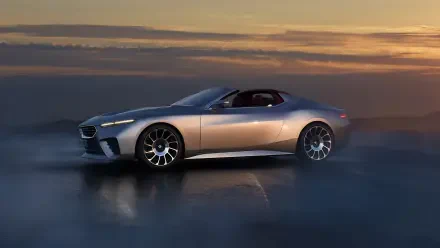 A sleek BMW Skytop car is showcased in this stunning 4K Ultra HD wallpaper, set against a dramatic sunset background. The vehicle's design highlights luxury and performance.