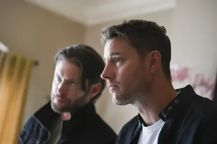 A close-up shot of Justin Hartley and Jensen Ackles in a scene from the TV show Tracker (2024), showcasing intense expressions in a modern interior setting.