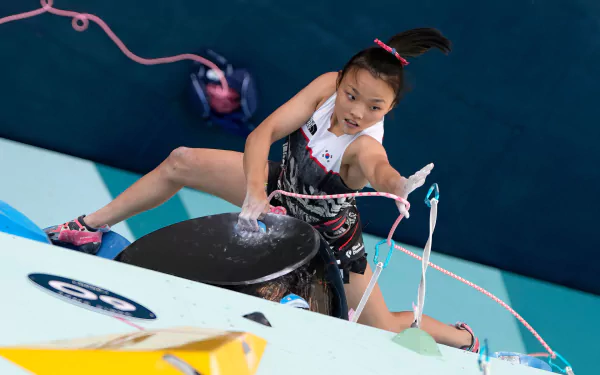 A dynamic HD wallpaper showcasing climbing, representing South Korea at the Olympic Games Paris 2024, capturing the spirit of sports and competition.