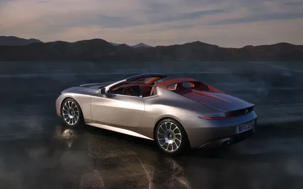 A sleek BMW Skytop convertible parked against a dramatic landscape, captured in stunning 4K Ultra HD, showcasing its elegant design and vibrant color accents.