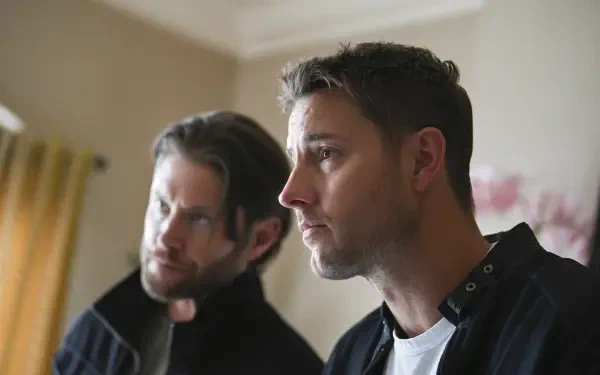 A close-up shot of Justin Hartley and Jensen Ackles in a scene from the TV show Tracker (2024), showcasing intense expressions in a modern interior setting.