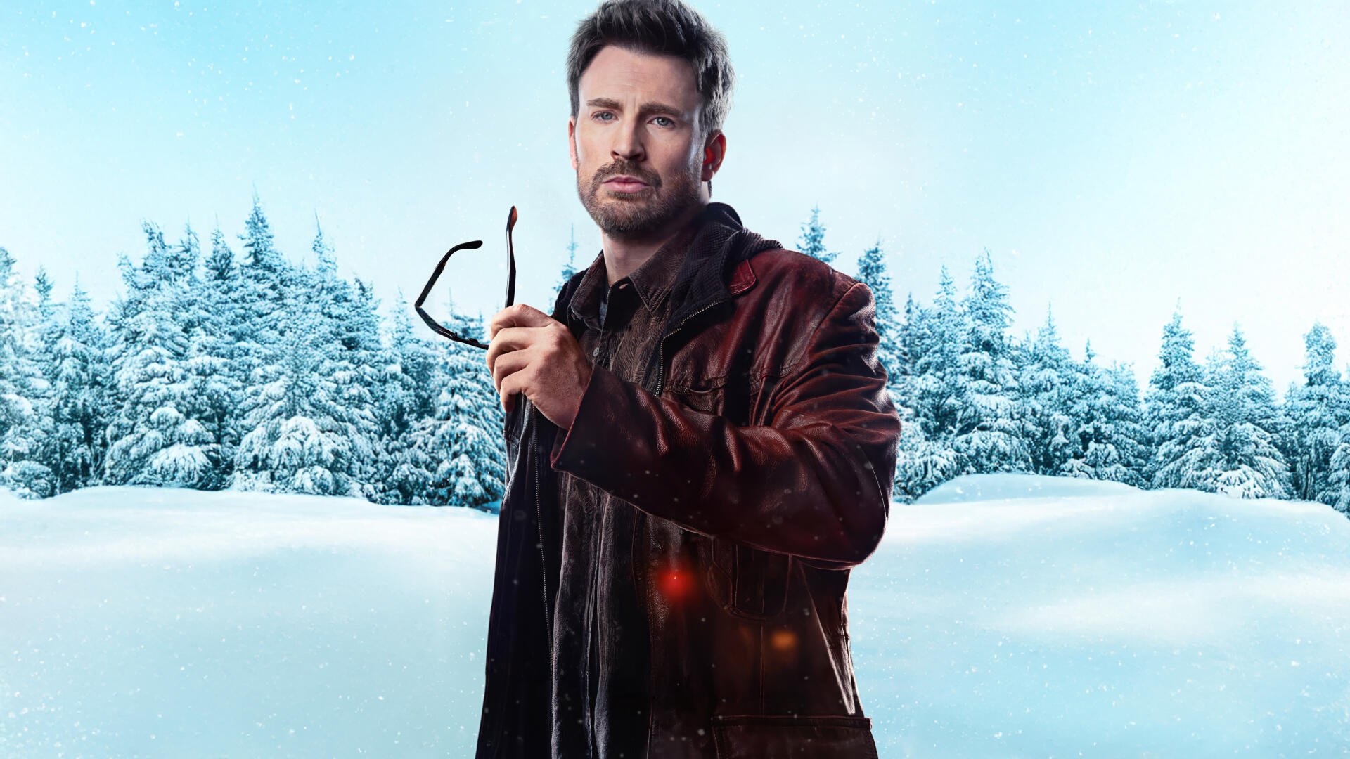 A promotional image from the movie Red One, featuring Chris Evans standing in a snow-covered landscape, holding glasses, set against a serene blue sky. 4K Ultra HD quality.