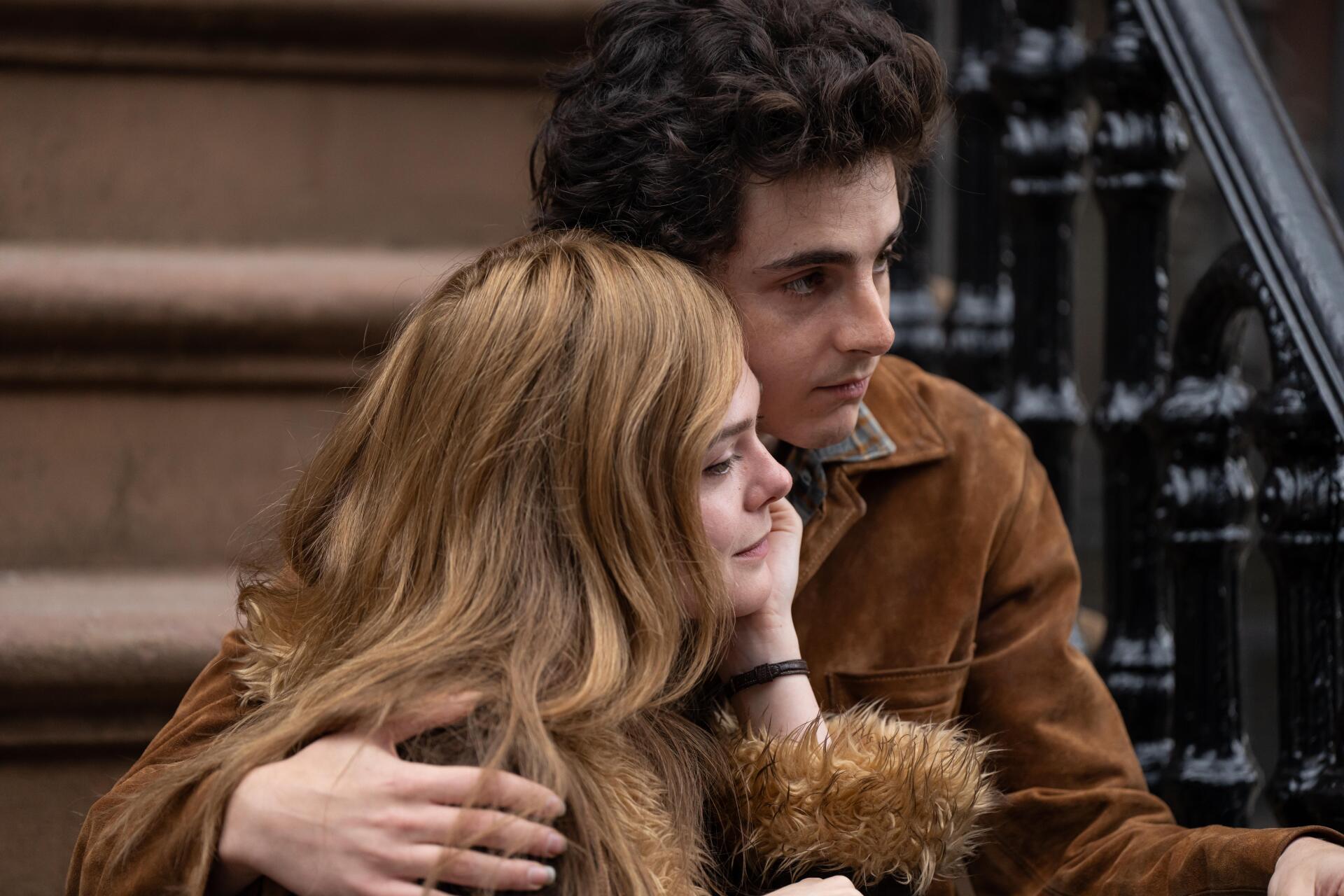 A scene from the movie A Complete Unknown featuring Timothée Chalamet and Elle Fanning, captured in 8K Ultra HD, showcasing a moment of intimacy on a staircase.