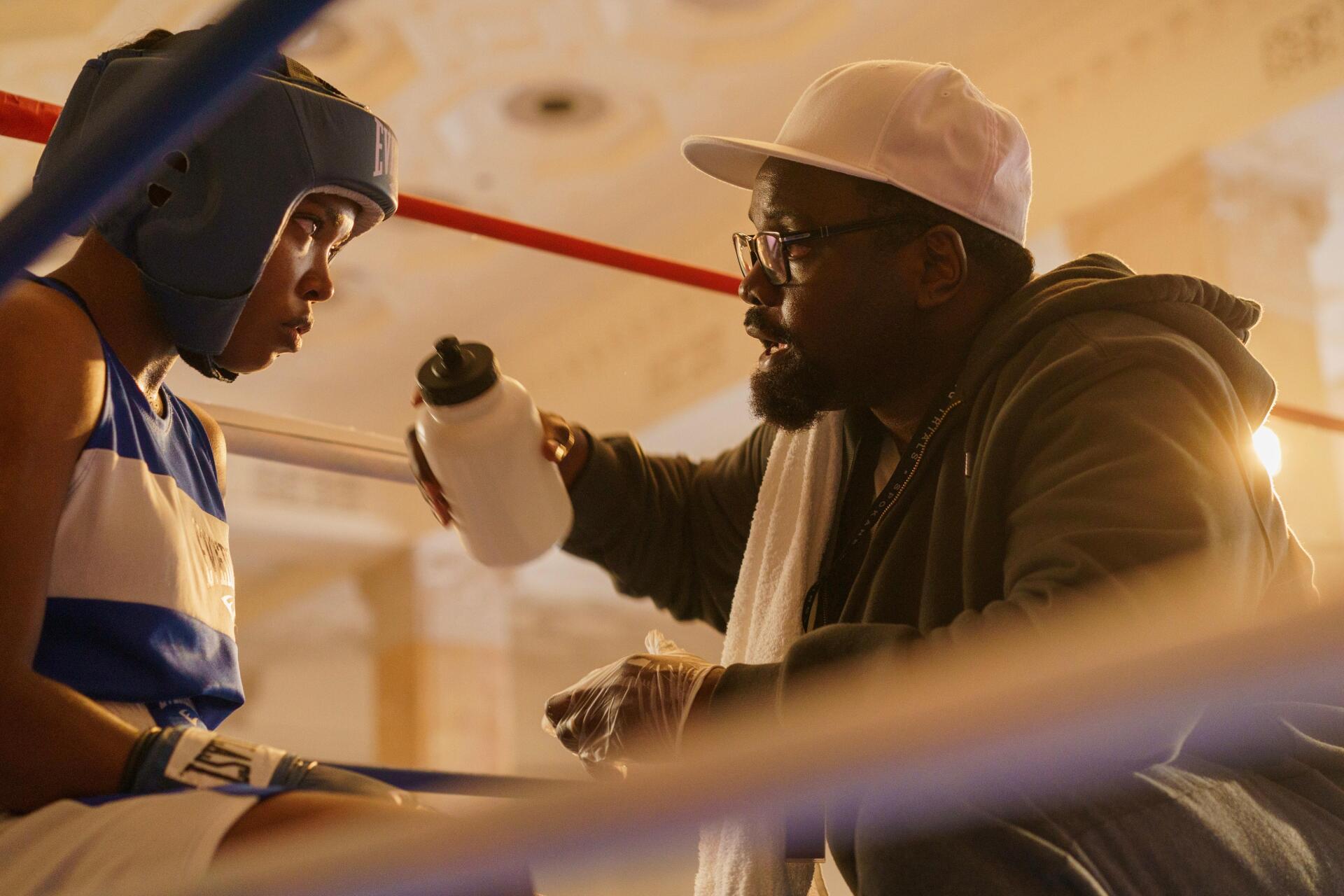A scene from the movie *The Fire Inside*, showcasing a boxer and his coach in a moment of focus and preparation, captured as a striking 4K Ultra HD desktop wallpaper.