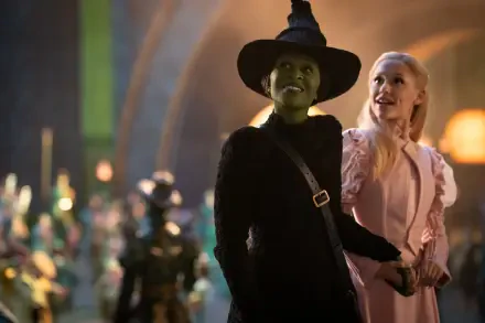 Cynthia Erivo and Ariana Grande shine in a scene from the movie Wicked, showcasing their characters in a vibrant, magical setting. 4K Ultra HD quality wallpaper.