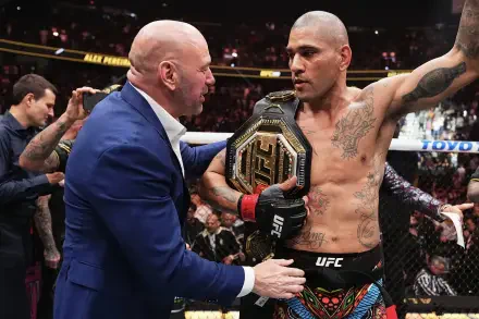 Alex Pereira celebrates with his championship belt in the UFC octagon, receiving praise from a figure in a suit, highlighting the excitement of MMA sports. HD desktop wallpaper.