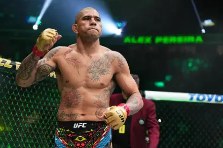 Alex Pereira, an MMA fighter, stands confidently in the UFC octagon, showcasing his tattoos and intense focus. This dynamic image serves as a vibrant 4K Ultra HD desktop wallpaper.