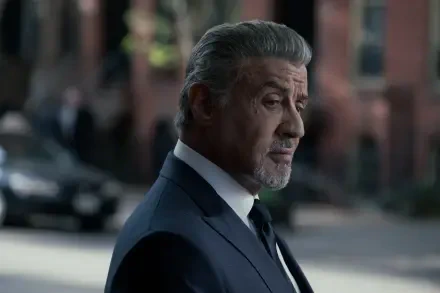 A side profile of Sylvester Stallone in a suit, captured in a scene from the TV show Tulsa King, showcasing a cinematic moment in striking 4K Ultra HD detail.