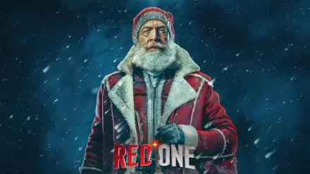 A striking 4K Ultra HD wallpaper featuring a weathered figure in a red coat and hat against a snowy backdrop, representing the movie Red One.