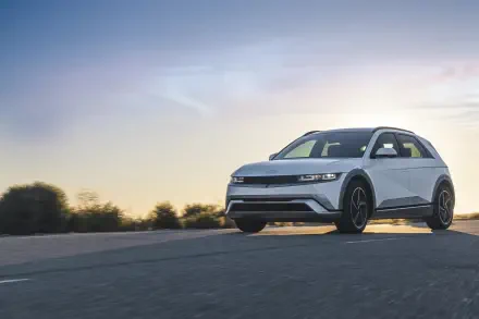 A sleek Hyundai IONIQ 5 car on an open road at sunset, showcased in vibrant 4K Ultra HD, highlighting its modern design and performance.