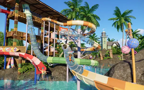 HD PC desktop wallpaper from the video game Planet Coaster 2, featuring a vibrant water park with colorful slides, palm trees, and tropical scenery.