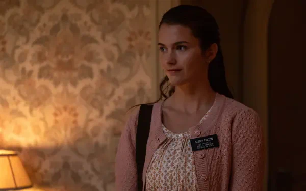 Chloe East stars in Heretic (2024), depicted in this 4K Ultra HD wallpaper, showcasing her thoughtful expression against a softly lit, vintage background.