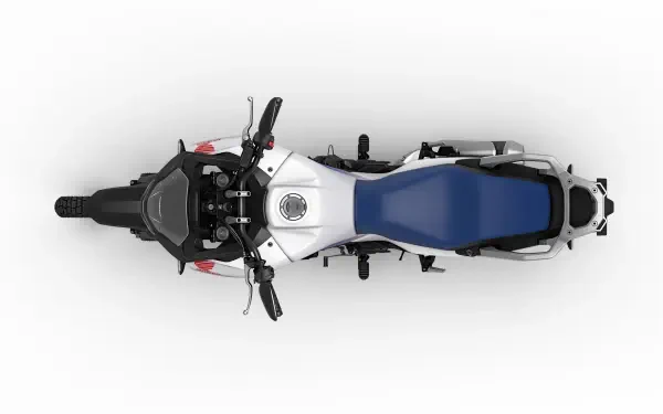 An overhead view of a Honda XL750 Transalp motorcycle, showcasing its sleek design and vibrant blue seat, set against a clean, white background for an engaging 4K Ultra HD display.