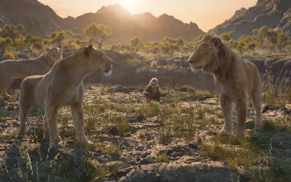 A stunning HD wallpaper featuring Mufasa from The Lion King, showcasing a lion, lioness, and a monkey in a natural landscape during sunset, highlighting the film's majestic essence.
