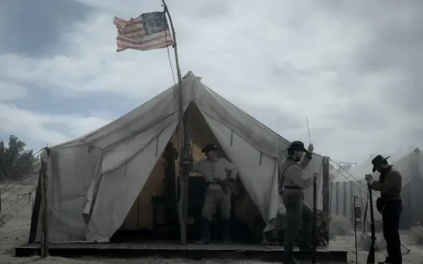 A scene from the TV show American Primeval, featuring a military tent with soldiers in a dusty landscape under a cloudy sky, creating a dramatic and historical atmosphere.