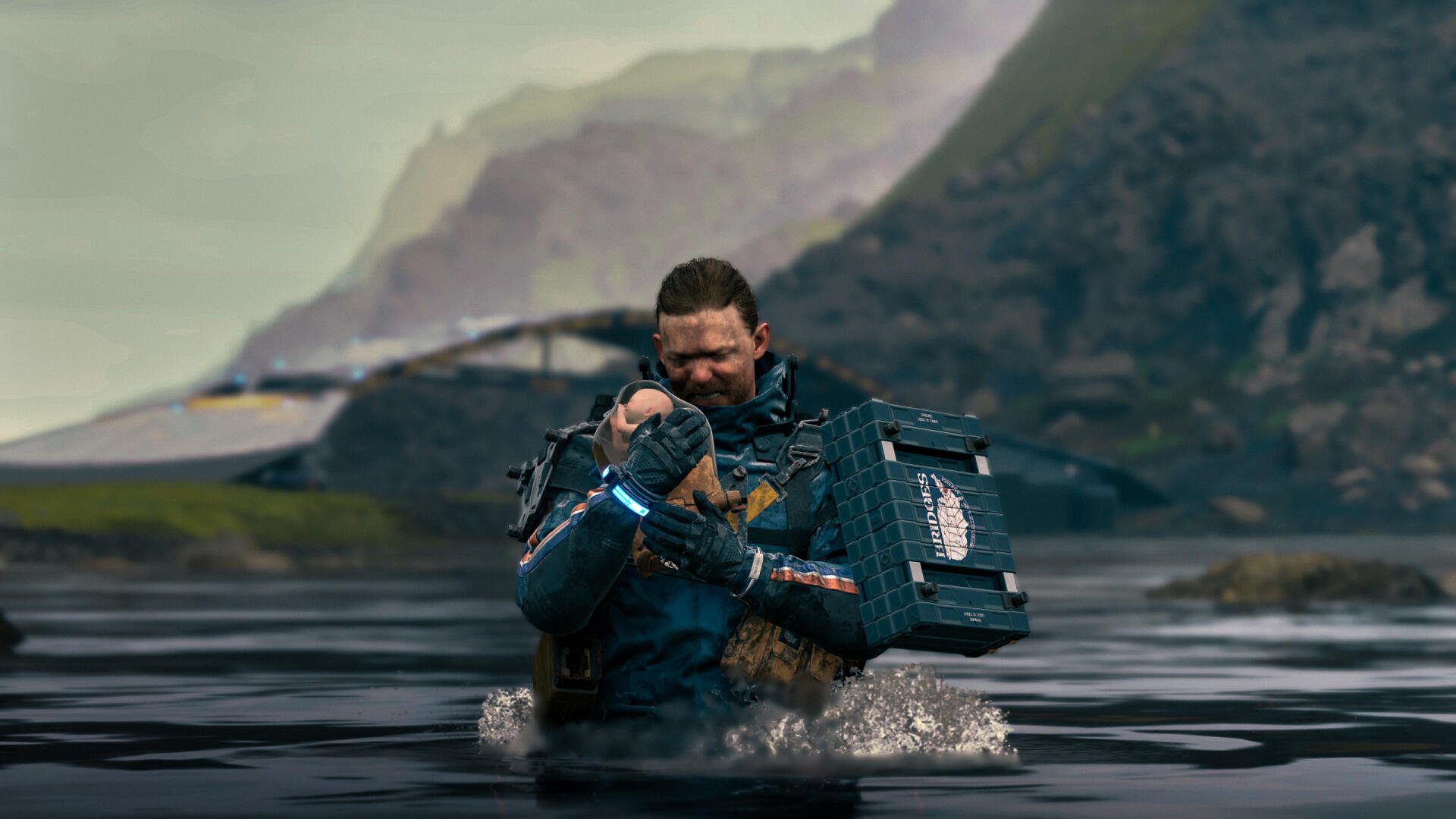 A powerful scene from Death Stranding 2: On The Beach, featuring a character wading through water while holding a bundle, set against a dramatic landscape. HD PC desktop wallpaper.