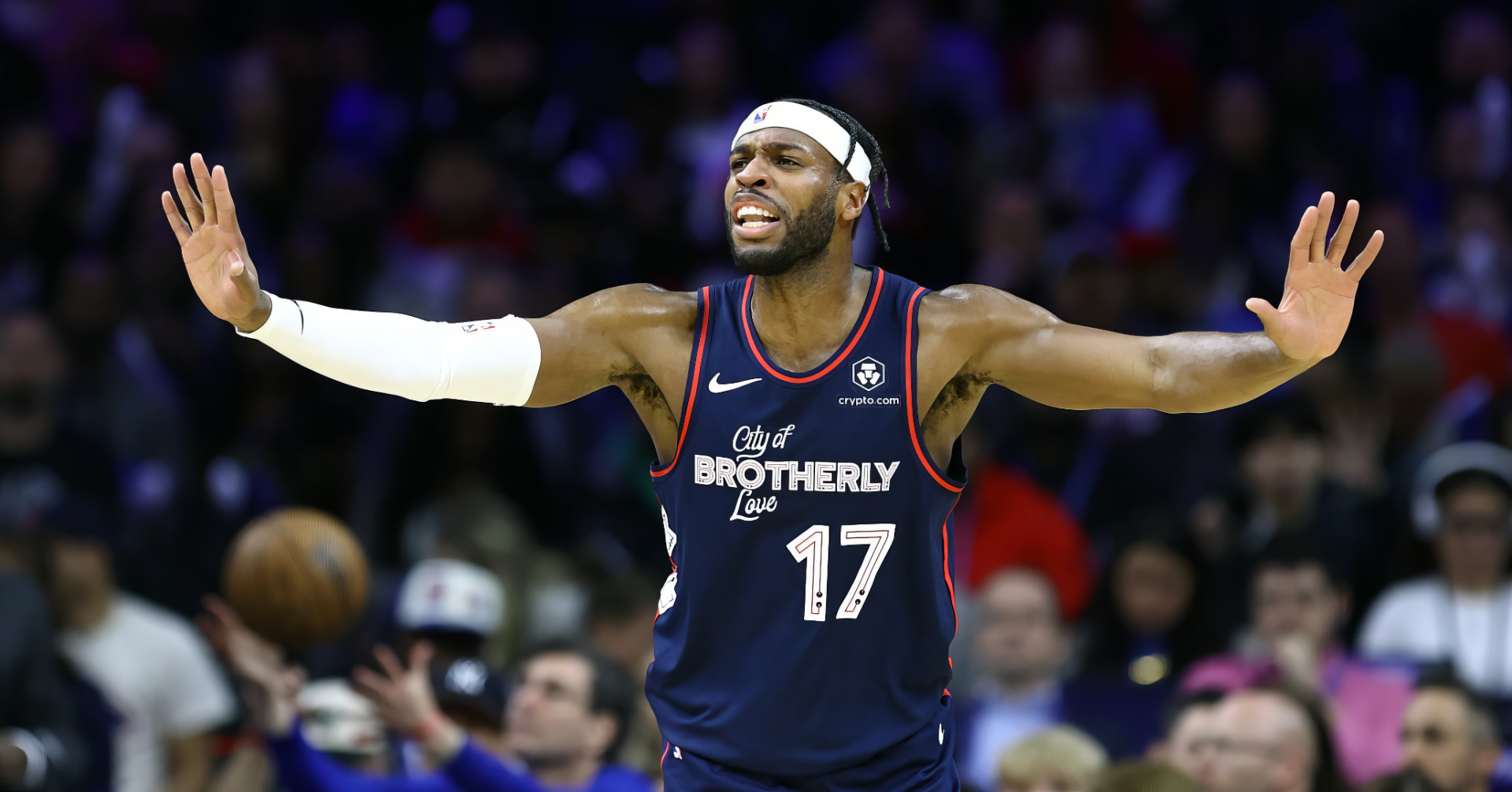 HD PC wallpaper featuring NBA player Buddy Hield in a Los Angeles Clippers uniform, actively gesturing on the basketball court during a game.