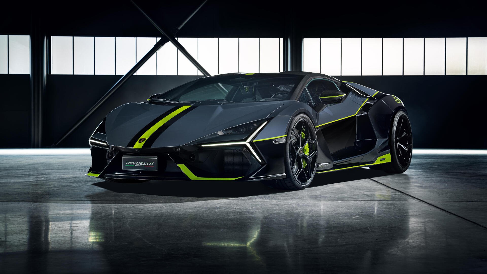 Black Lamborghini sports car with neon green accents showcased in a sleek industrial garage, featured as an 8K Ultra HD PC desktop wallpaper background.