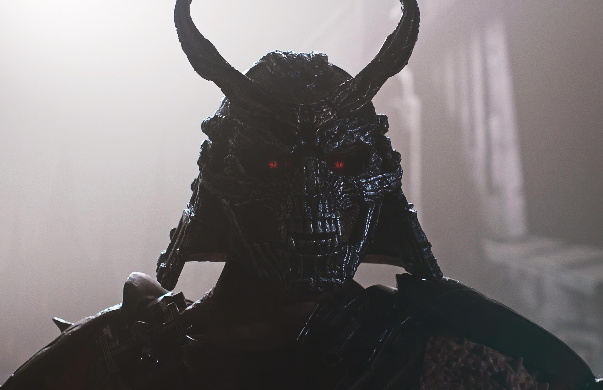 HD PC desktop wallpaper featuring a dark, horned warrior from the movie Mortal Kombat II, with glowing red eyes and an ominous atmosphere.