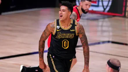 HD PC desktop wallpaper featuring NBA player Kyle Kuzma in a Los Angeles Lakers uniform during a basketball game.