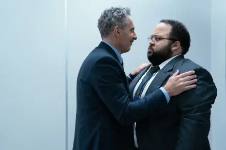 A scene from the TV show Severance, featuring John Turturro and Zach Cherry in a tense moment, showcasing their characters in a sleek, modern office setting. 4K Ultra HD wallpaper.