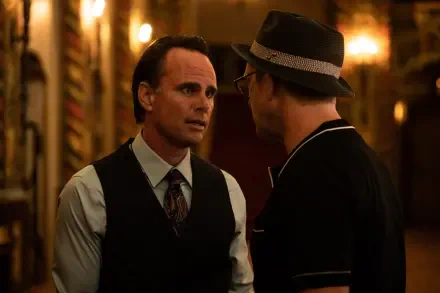 A dramatic scene from the movie Queen of the Ring, featuring Walton Goggins in a tense conversation, set against a richly detailed background. 4K Ultra HD wallpaper.