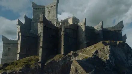 A dramatic landscape featuring a formidable castle perched on rocky cliffs, set against a moody sky, inspired by the TV show Game of Thrones. High-definition desktop wallpaper.