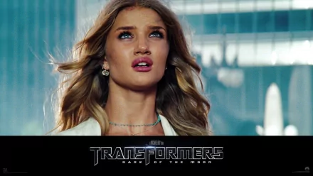 HD PC desktop wallpaper featuring a close-up of a female character from the movie Transformers: Dark of the Moon with the film’s logo beneath.