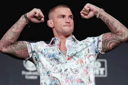 HD PC desktop wallpaper featuring UFC MMA fighter Dustin Poirier flexing his tattooed arms against a dark background.
