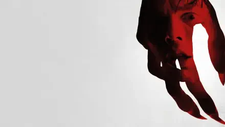Nosferatu (2024) 4K Ultra HD PC desktop wallpaper featuring a dark, eerie figure partially obscured by shadow and red lighting on a light gray background.