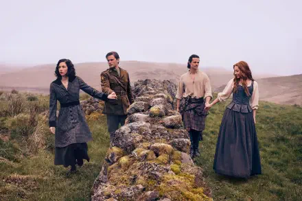 HD desktop wallpaper featuring four characters from the TV show Outlander: Blood of My Blood standing outdoors by a stone wall in a misty, grassy landscape.