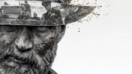Sisu 4K Ultra HD PC desktop wallpaper: gritty close-up of a bearded soldier's weathered face and helmet, fragments scattering into a pale background.