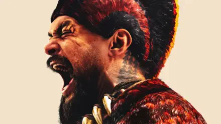 4K Ultra HD PC desktop wallpaper of a roaring Chief of War in a tribal headdress and fur armor — close-up painted face, open mouth and teeth, dramatic side lighting.